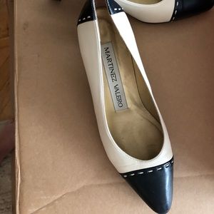 White / black rounded point heel.